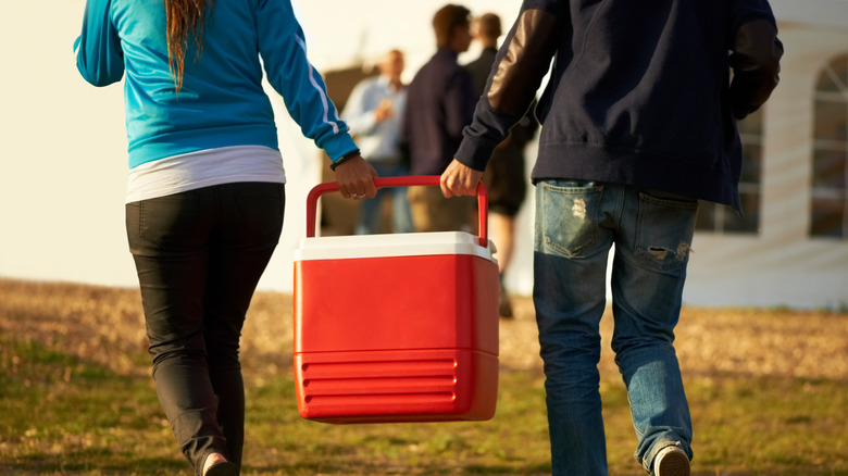 two people with cooler