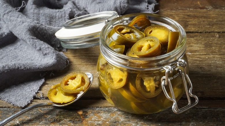 Pickled jalapeños in a jar