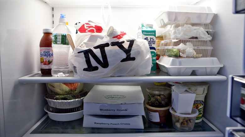 Leftover food containers in fridge