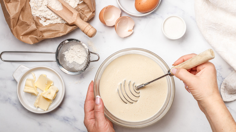 Person preparing pancake batter