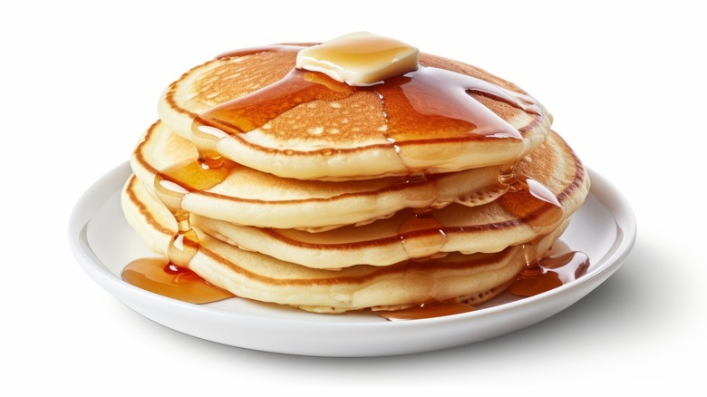 Stack of pancakes on white background