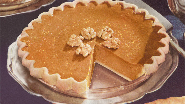 pumpkin pie with a slice taken out