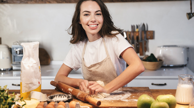 person making an apple pie