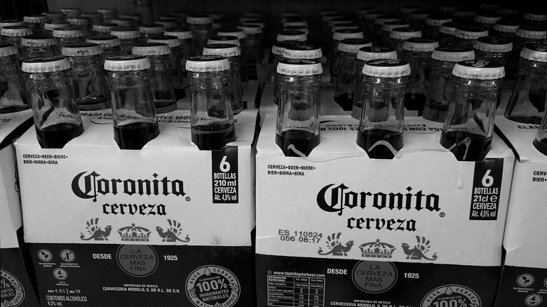 Six-packs of Coronita bottles on a shelf