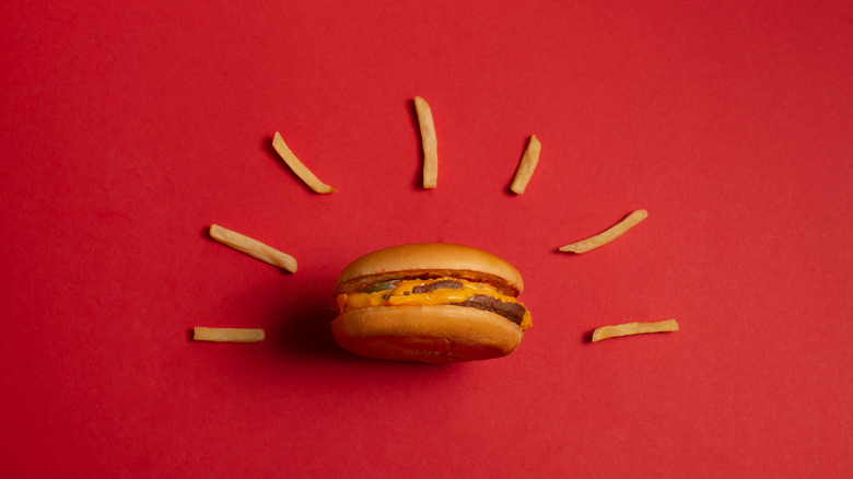 mcdonald's burger and fries on red background