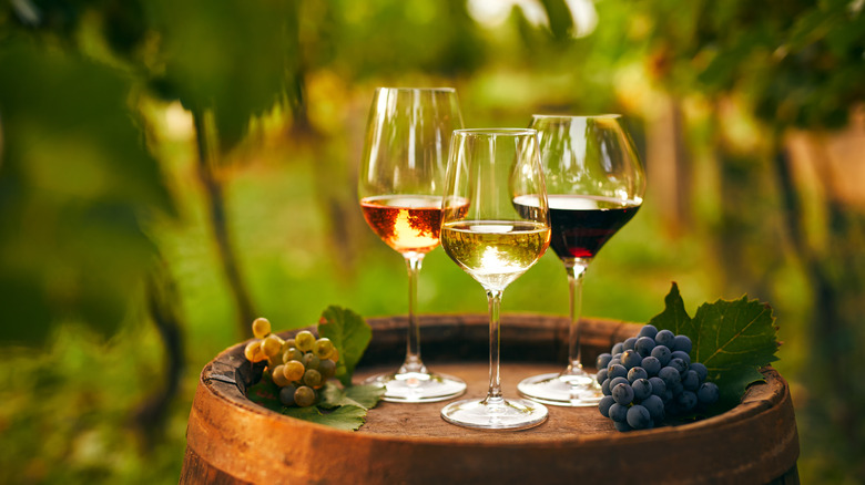 Wine and grapes on barrel