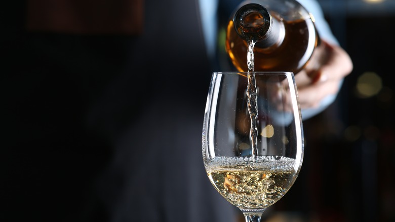 White wine poured in glass