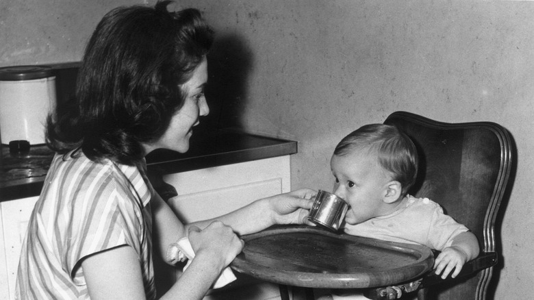 1940s mother feeding her baby