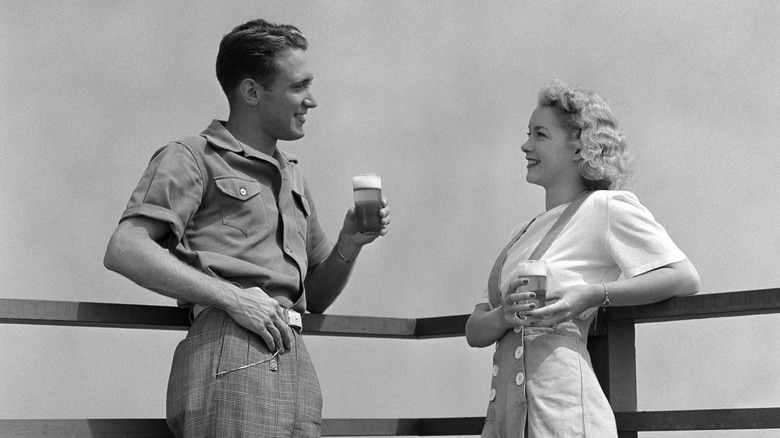 1940s couple with coffee outside