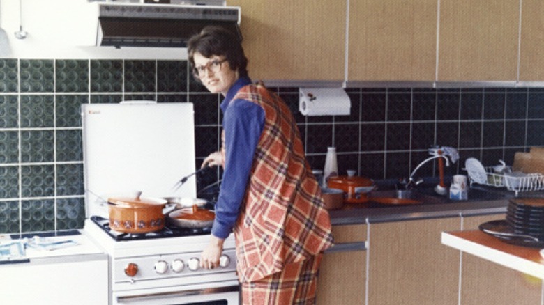 1970s woman cooking in kitchen