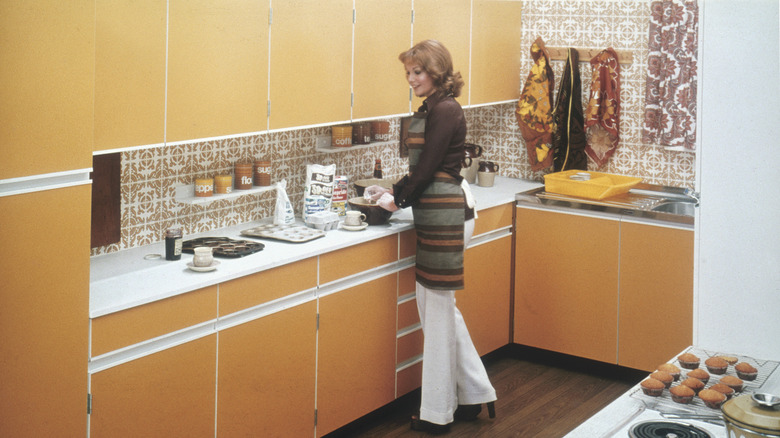 woman cooking in 1970s kitchen