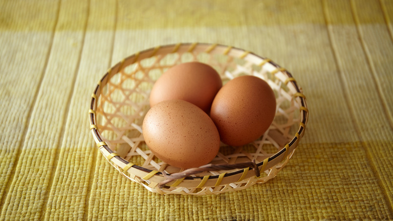 basket of eggs on table