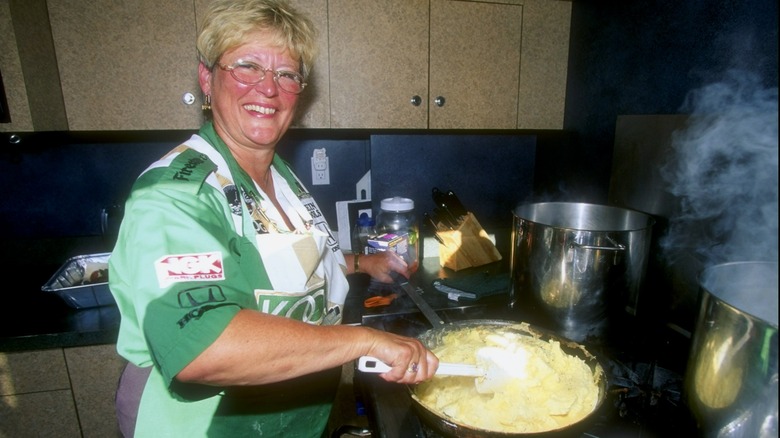 1990s woman cooking eggs