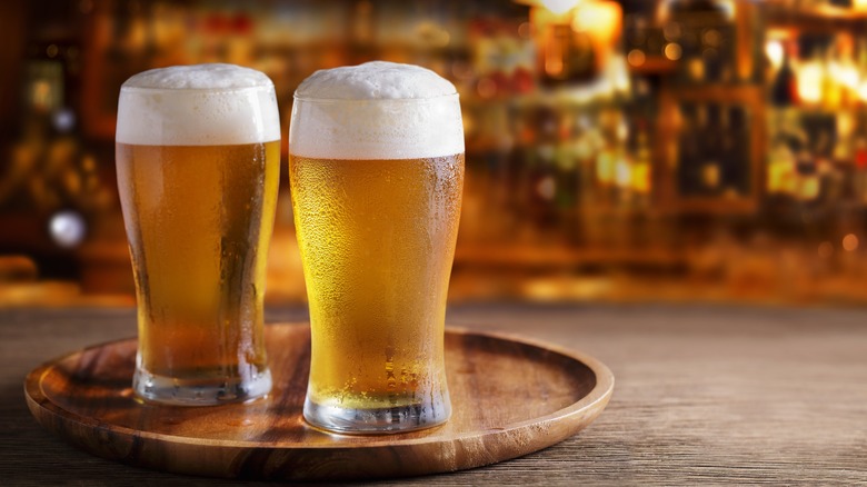 Beer glasses on wooden tray