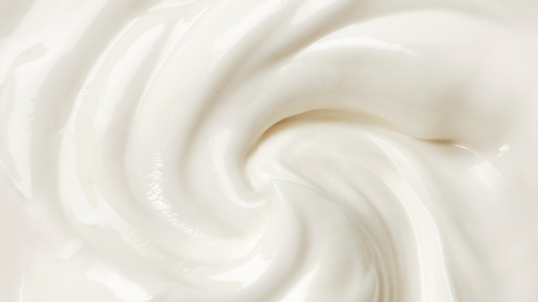 Swirl of sour cream close to camera