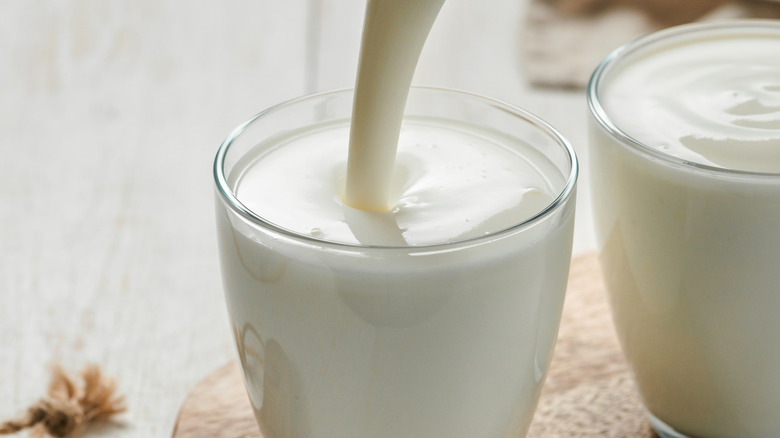 Buttermilk being poured into glass