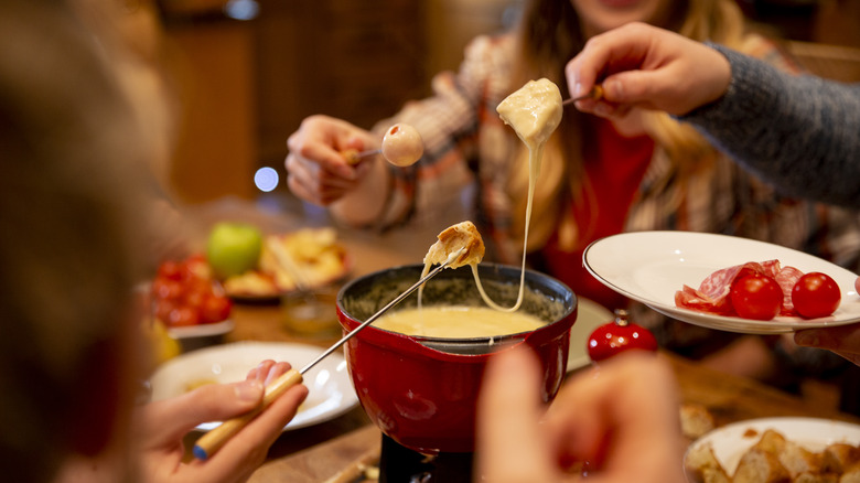 what do you dip in cheese fondue at the melting pot