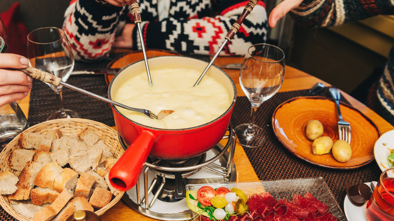 People eating fondue