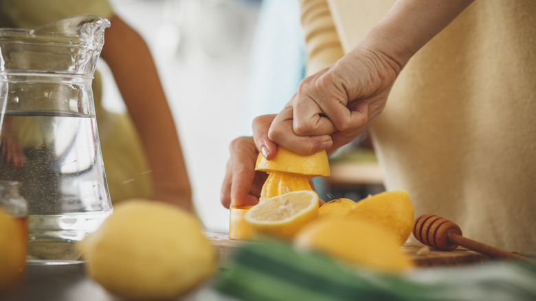 Squeezing lemon with a reamer