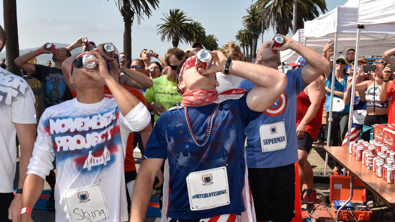 Men drinking beers at Beer Mile Classic