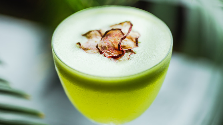 Green cocktail with foam