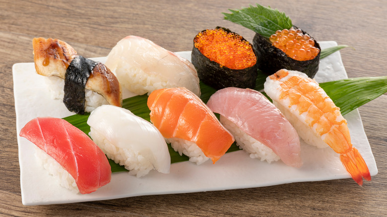 different types of sushi arranged on a plate