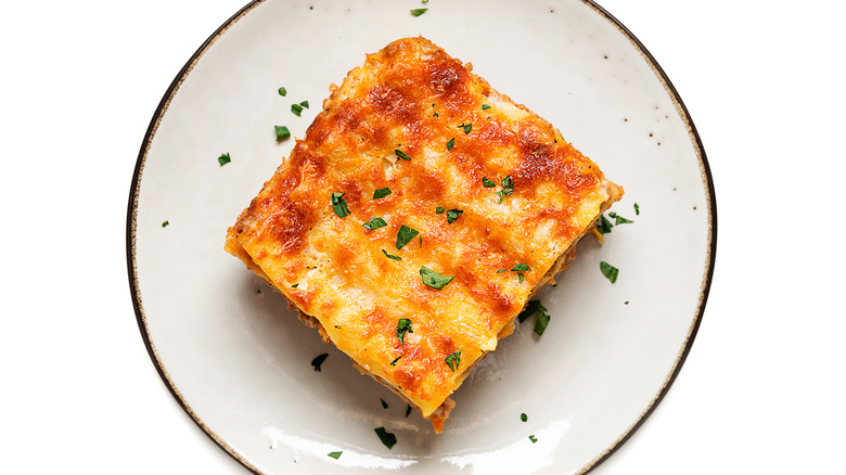 Plate with slice of lasagna on it