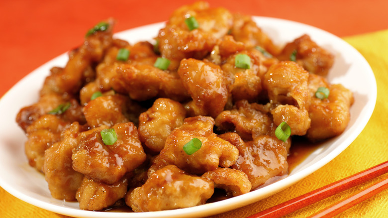 Orange chicken platter with green onion on top