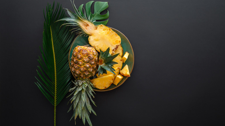 birdseye of pineapple and slices palm leaf