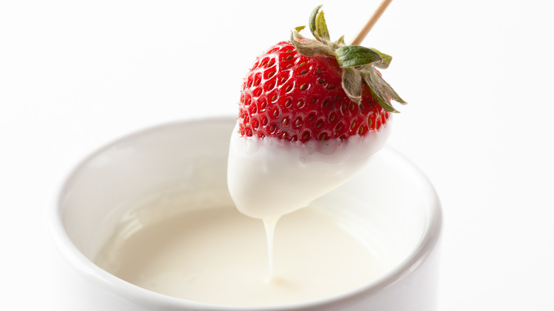 dipping strawberries in white chocolate