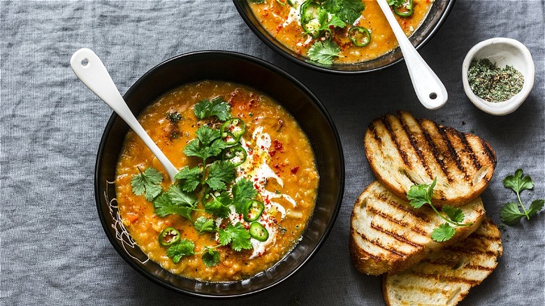 Bowl of lentil soup with herbs 