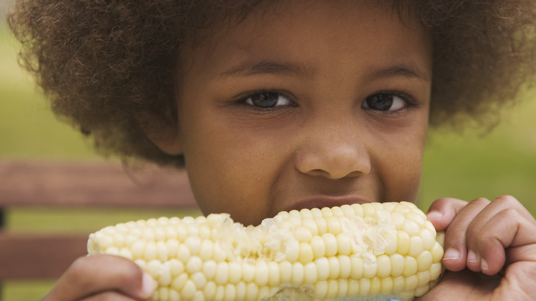 Child eating corn on the cob