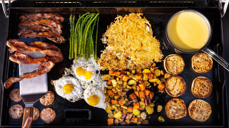 https://www.thedailymeal.com/img/gallery/how-to-clean-a-flat-top-grill-to-prevent-it-from-rusting/intro-1691469595.jpg