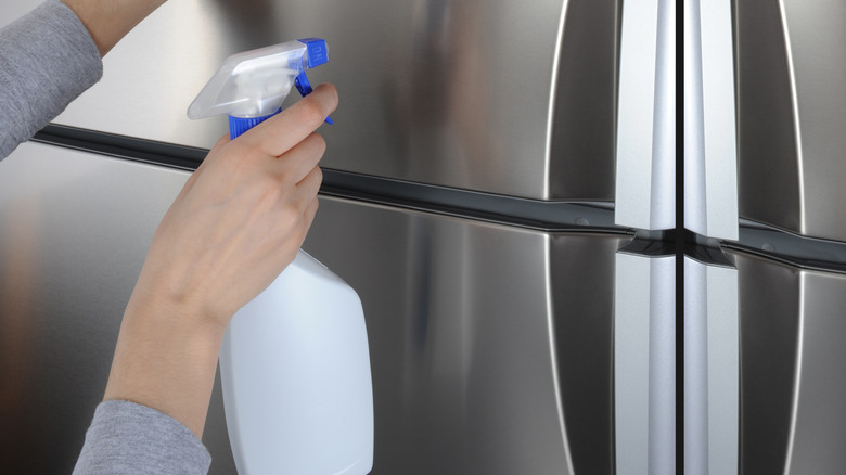 cleaning outer surface of fridge