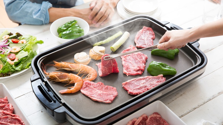 food cooking on a griddle