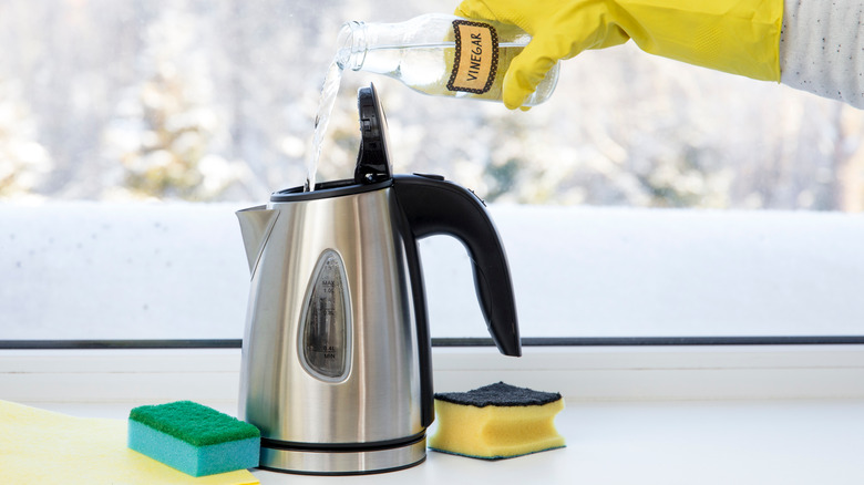 pouring vinegar into kettle