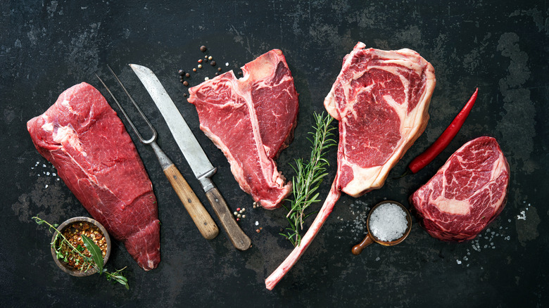 Various raw bone-in steaks