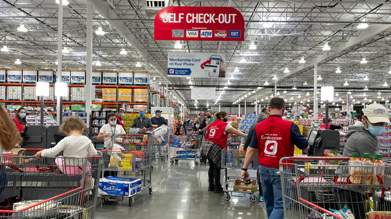 People checking out at Costco