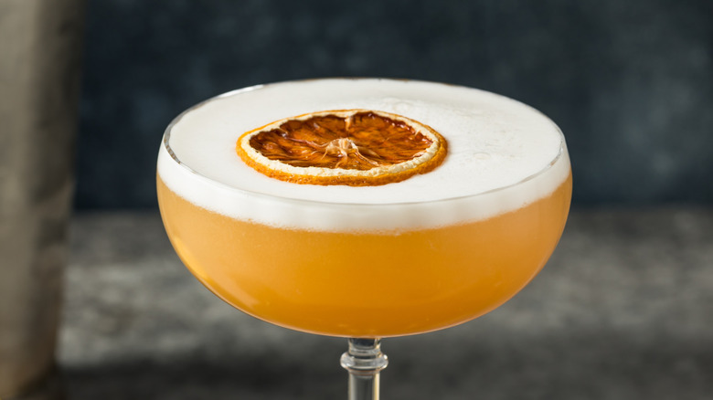 Frothy whiskey sour coupe glass