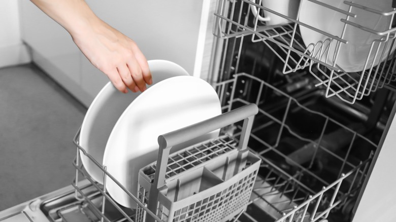 Dishes loaded into a dishwasher