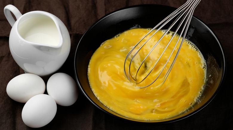 Whisk scrambling eggs