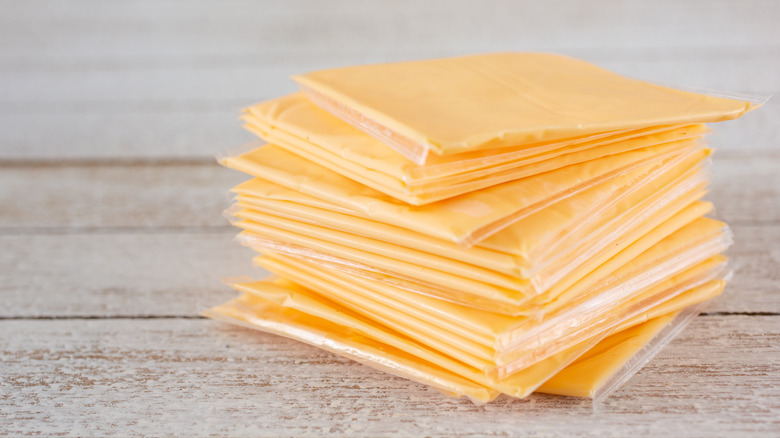 Stack of yellow American cheese