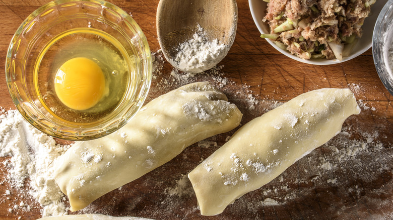 Floury table with egg rolls