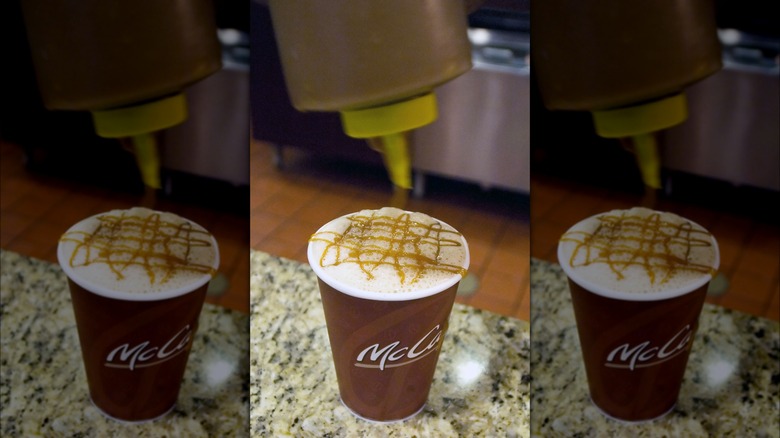 Caramel syrup poured on McCafe coffee