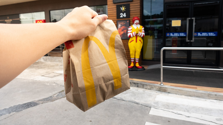 bag of McDonald's in front of a store