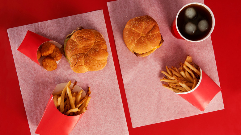 wendy's burgers, fries, and nuggets on red table