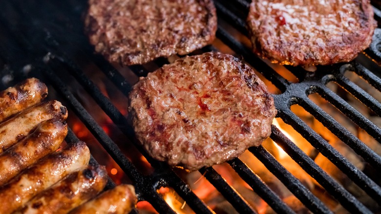 burger patties cooking on grill