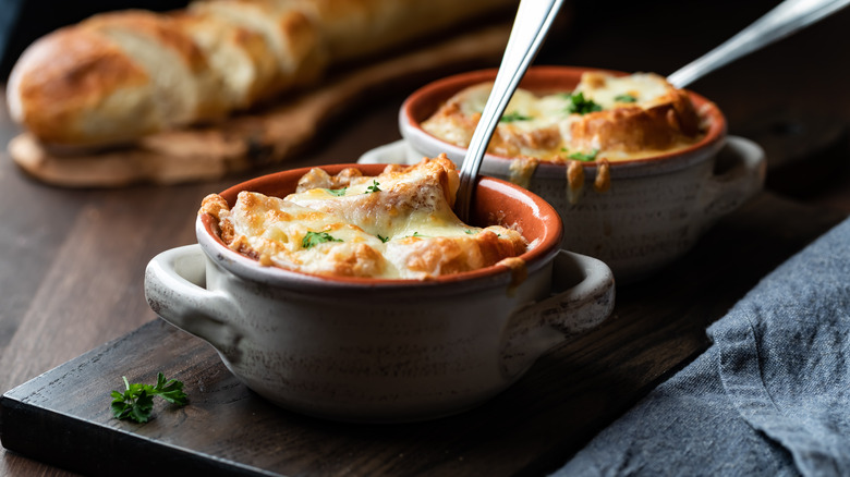 two bowls of cheesy french onion soup