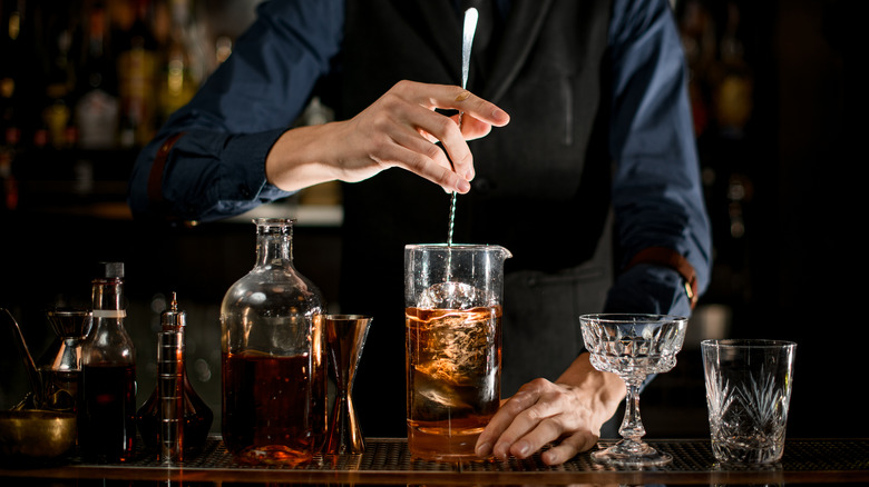 Bartender stirring cocktail