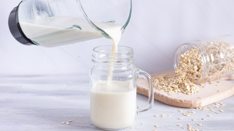 Pouring oat milk from blender